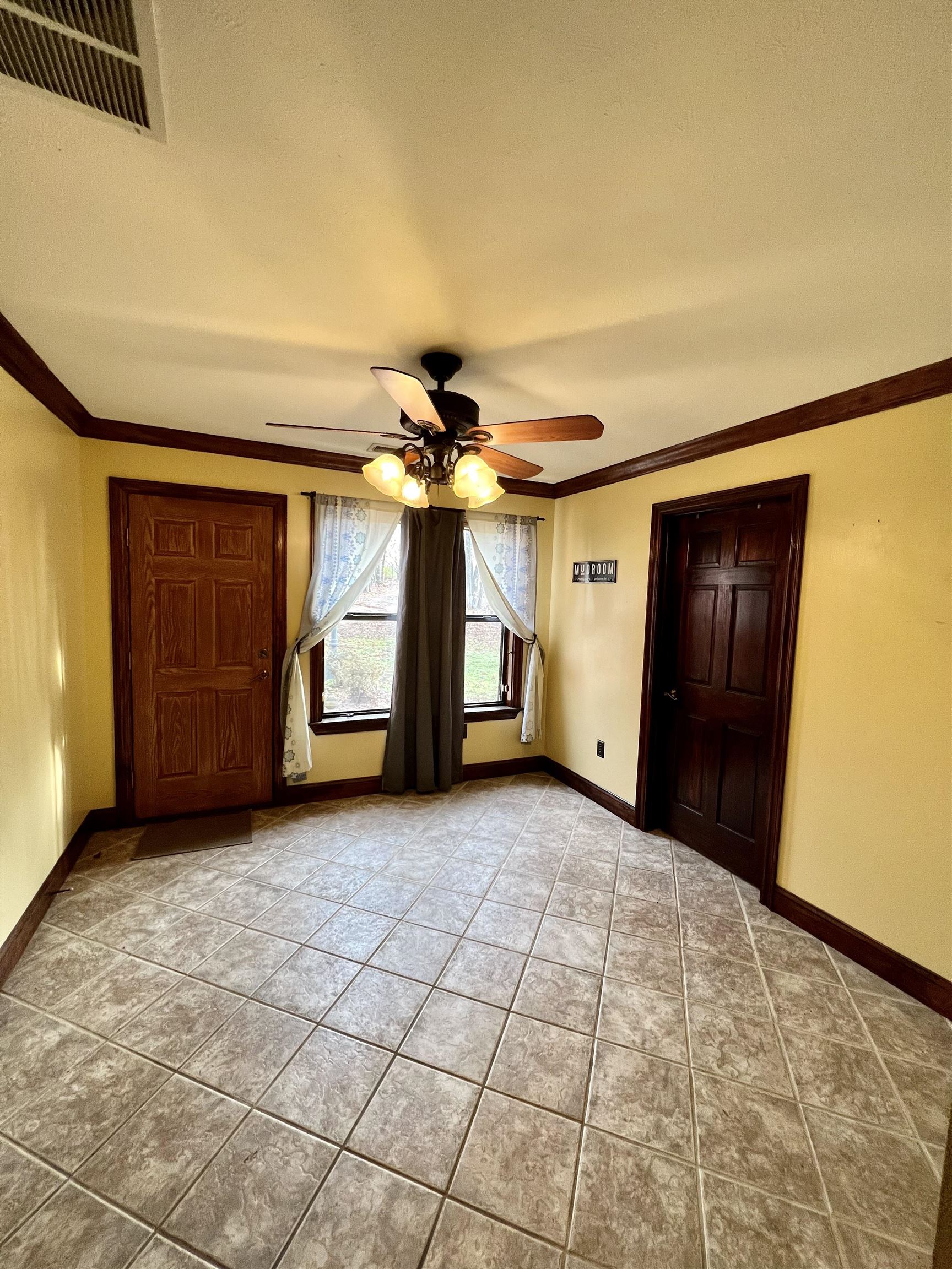 2522 Dunlap Orphanage Road Brighton, TN 38011 - Photo 11 of 22 a view of a livingroom with a ceiling fan and window
