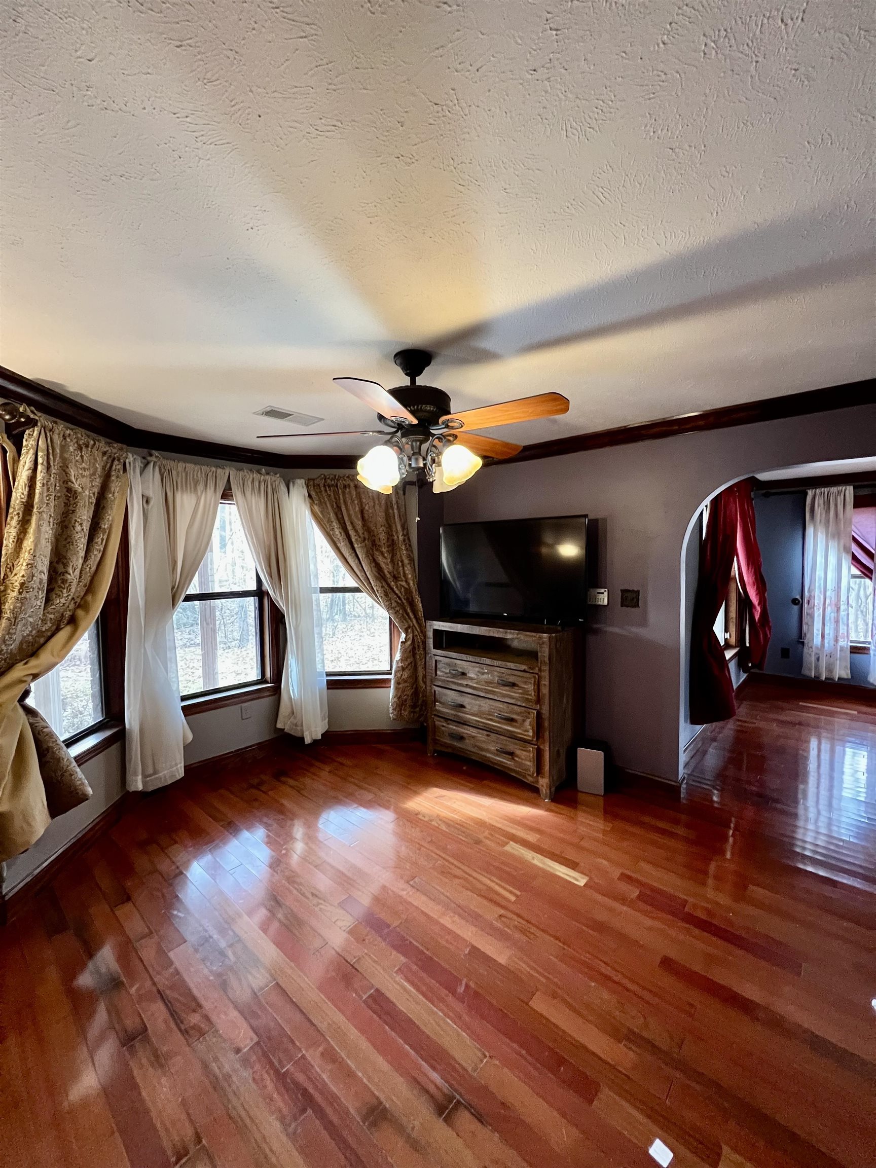 2522 Dunlap Orphanage Road Brighton, TN 38011 - Photo 15 of 22 an empty room with wooden floor fire place and windows