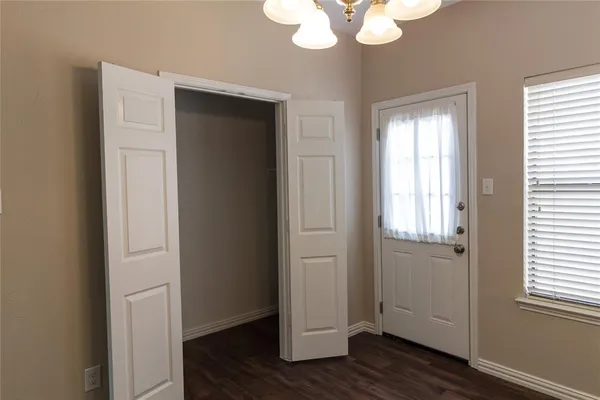 a view of an entryway with wooden floor