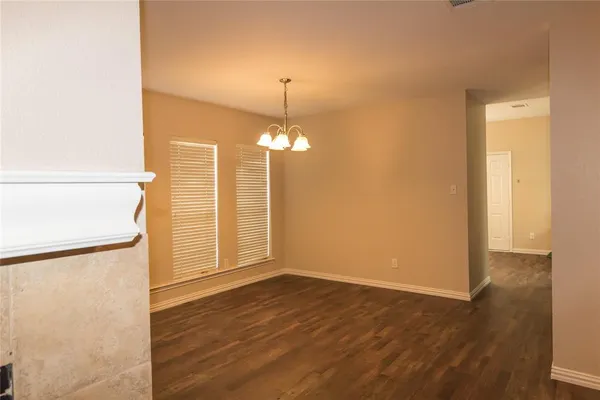 a view of a livingroom with wooden floor