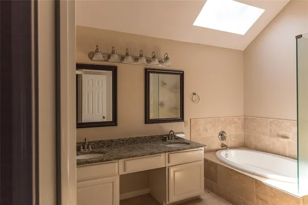 a bathroom with a bathtub and a sink