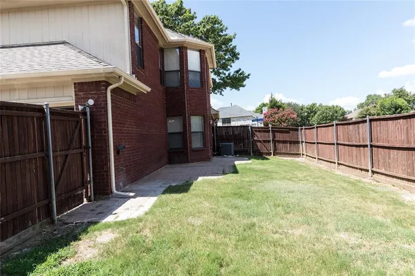 a view of backyard with seating space