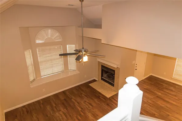a view of a livingroom with furniture and a ceiling fan