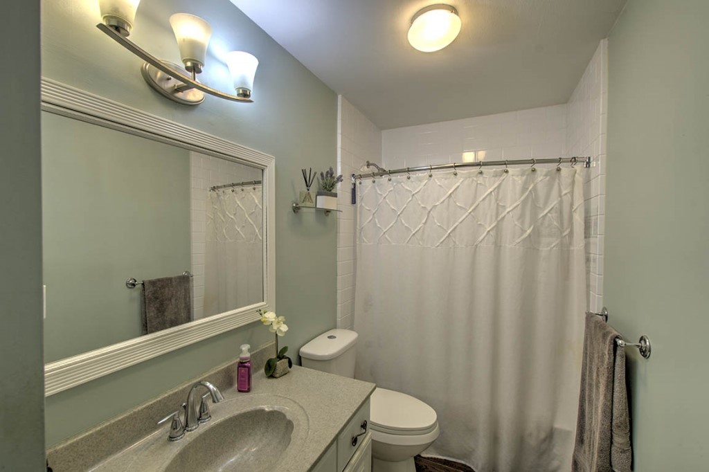 2261 Hoyt Court Decatur, IL 62526 - Photo 13 of 26 a bathroom with a sink vanity mirror and toilet