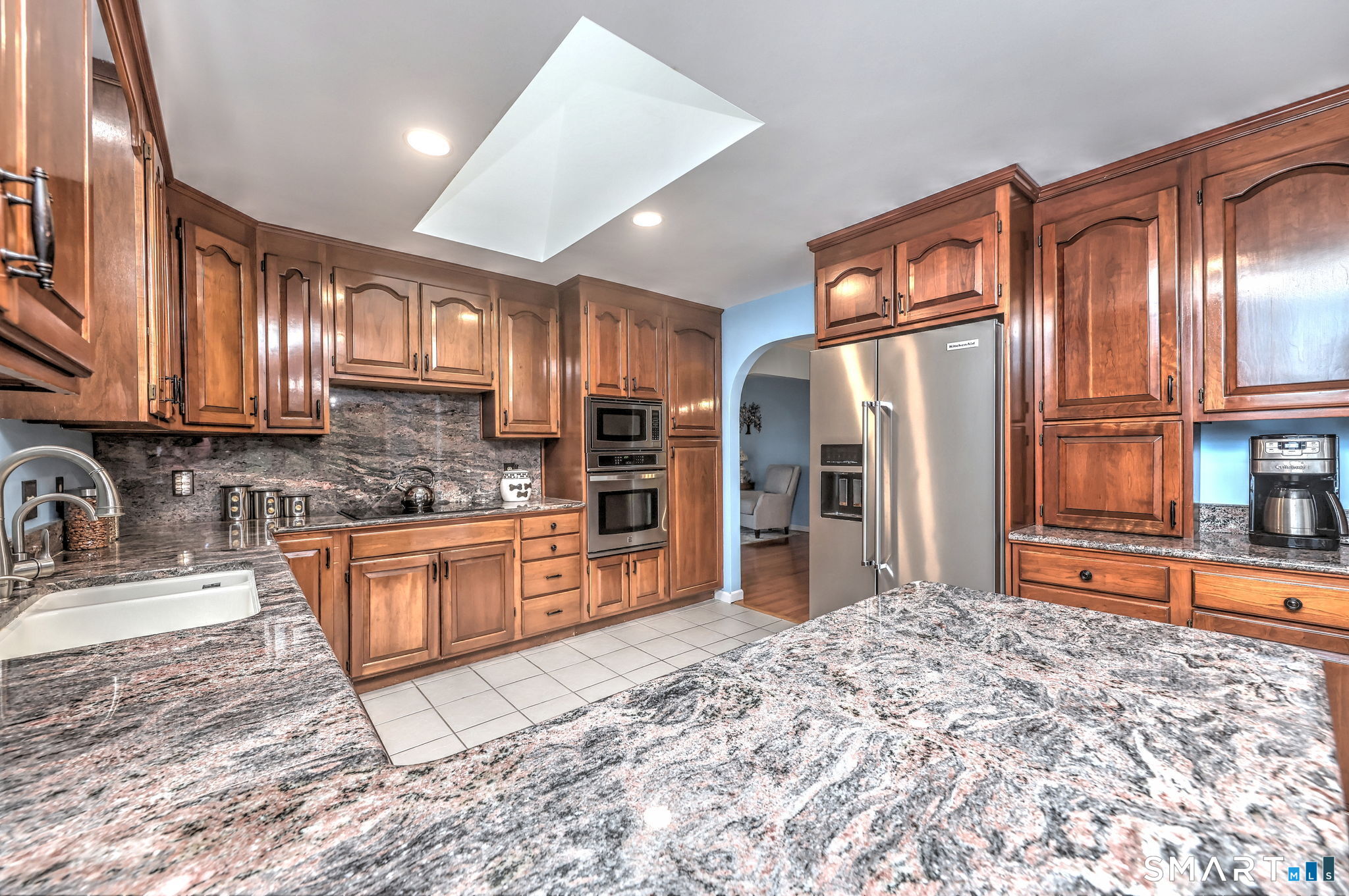 2262 Ridge Road North Haven, CT 06473 - Photo 3 of 40 a kitchen with stainless steel appliances granite countertop a refrigerator and a sink