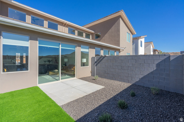 2972 West 570 North Hurricane, UT 84737 - Photo 79 of 104 Rear view of house featuring a patio area and stucco siding
