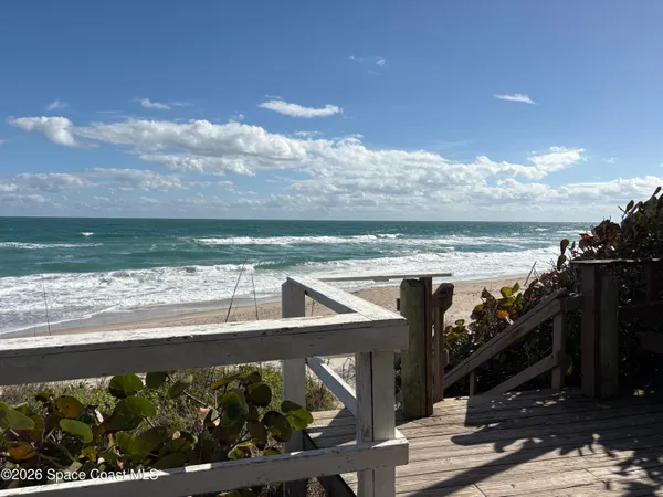 a view of a street with an ocean view