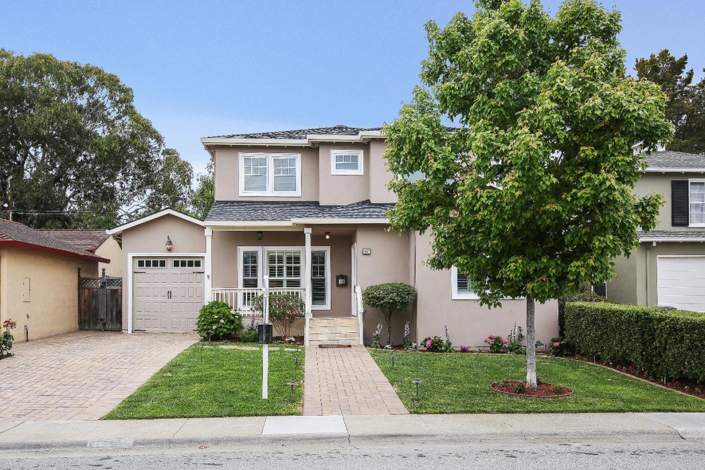 1637 Westmoor Road Burlingame, CA 94010 - Photo 1 of 54 a front view of a house with a yard and garage
