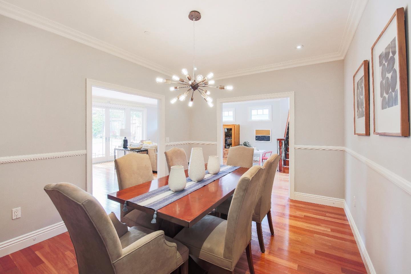 1637 Westmoor Road Burlingame, CA 94010 - Photo 17 of 54 a dining room with furniture a rug and wooden floor