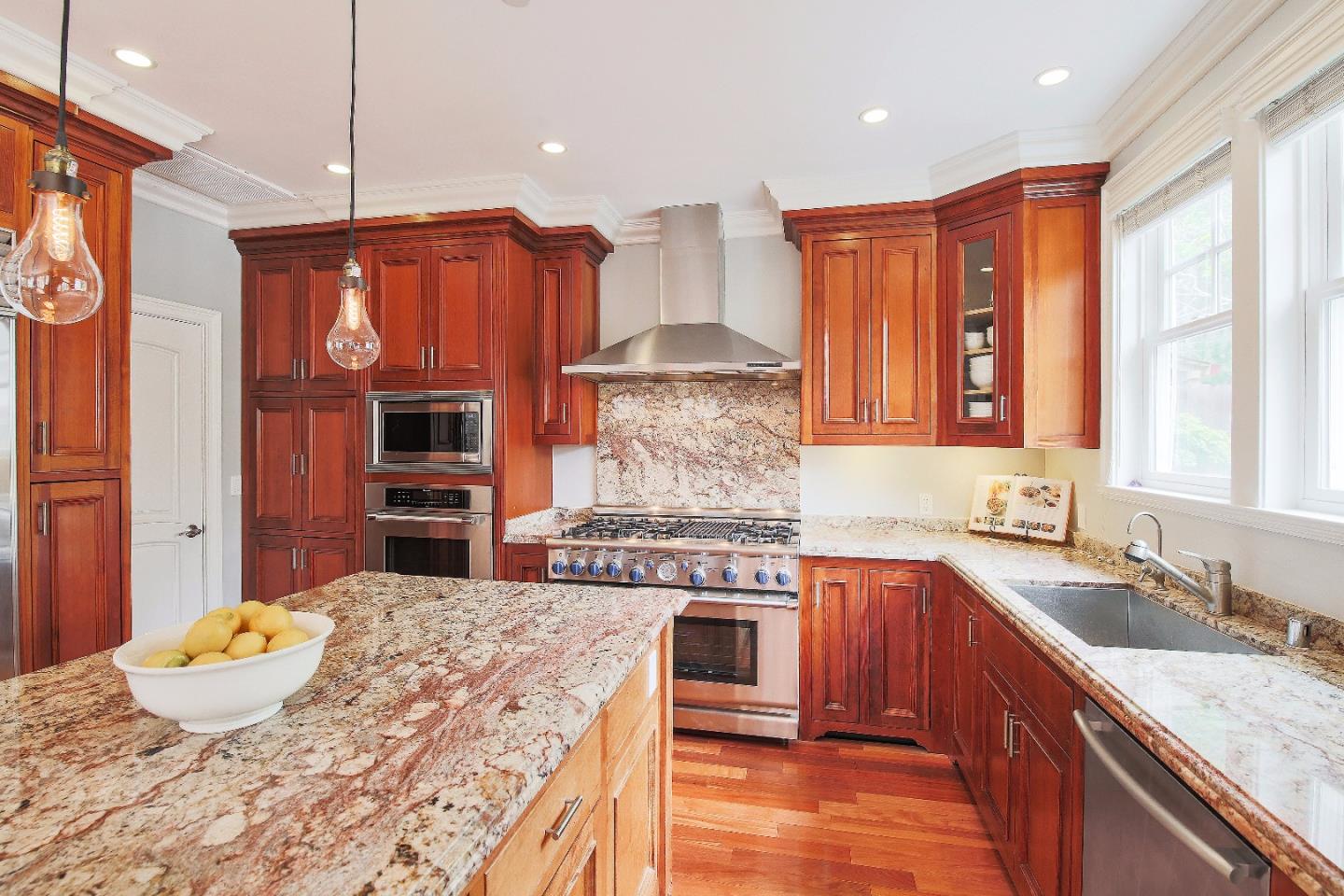 1637 Westmoor Road Burlingame, CA 94010 - Photo 22 of 54 a kitchen with stainless steel appliances granite countertop a stove a sink dishwasher and a refrigerator with wooden floor