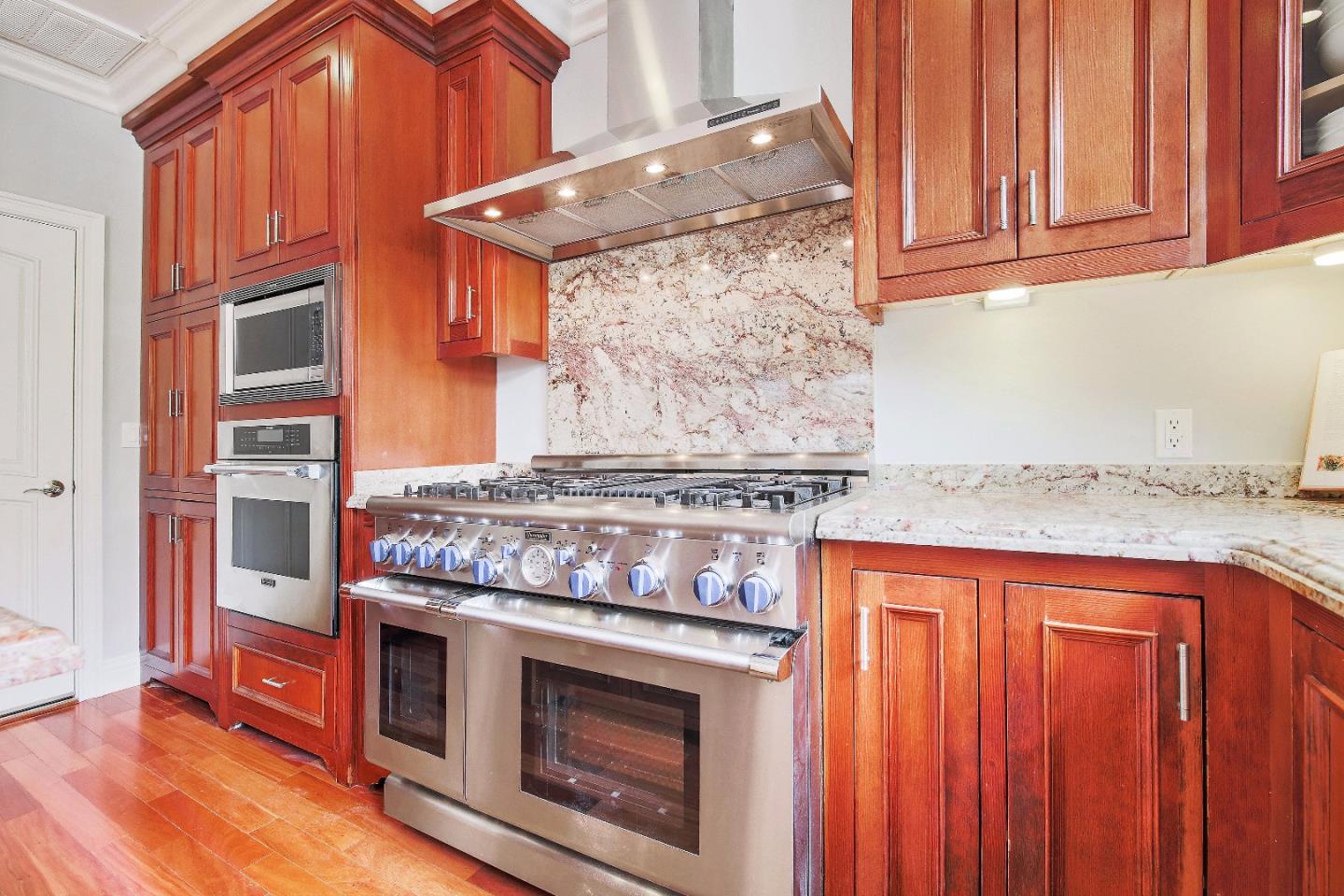 1637 Westmoor Road Burlingame, CA 94010 - Photo 23 of 54 a stove top oven sitting inside of a kitchen