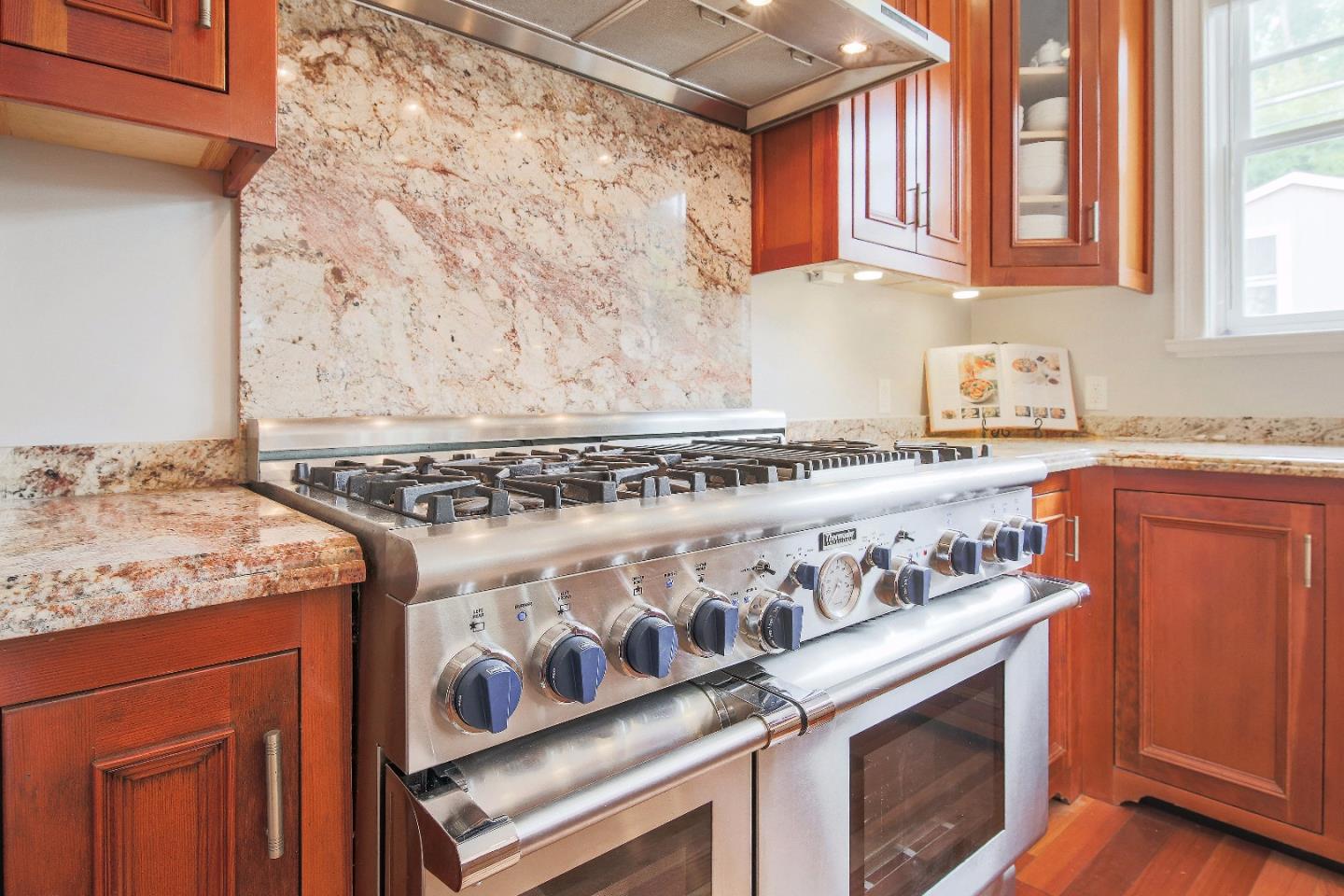 1637 Westmoor Road Burlingame, CA 94010 - Photo 24 of 54 a kitchen with granite countertop a stove and a sink