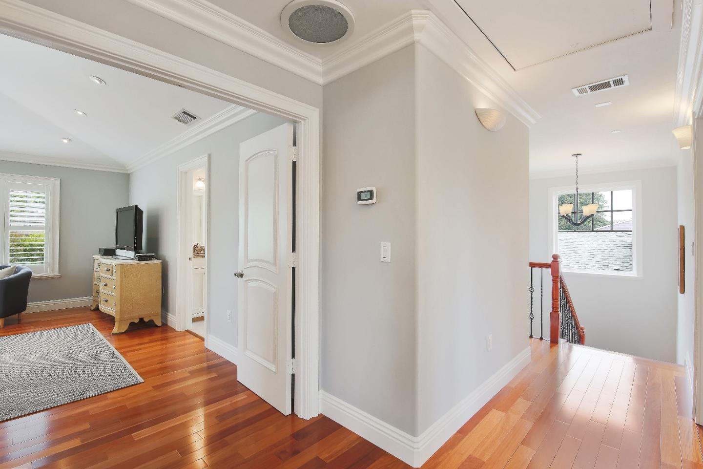1637 Westmoor Road Burlingame, CA 94010 - Photo 34 of 54 a view of a hallway with wooden floor and furniture