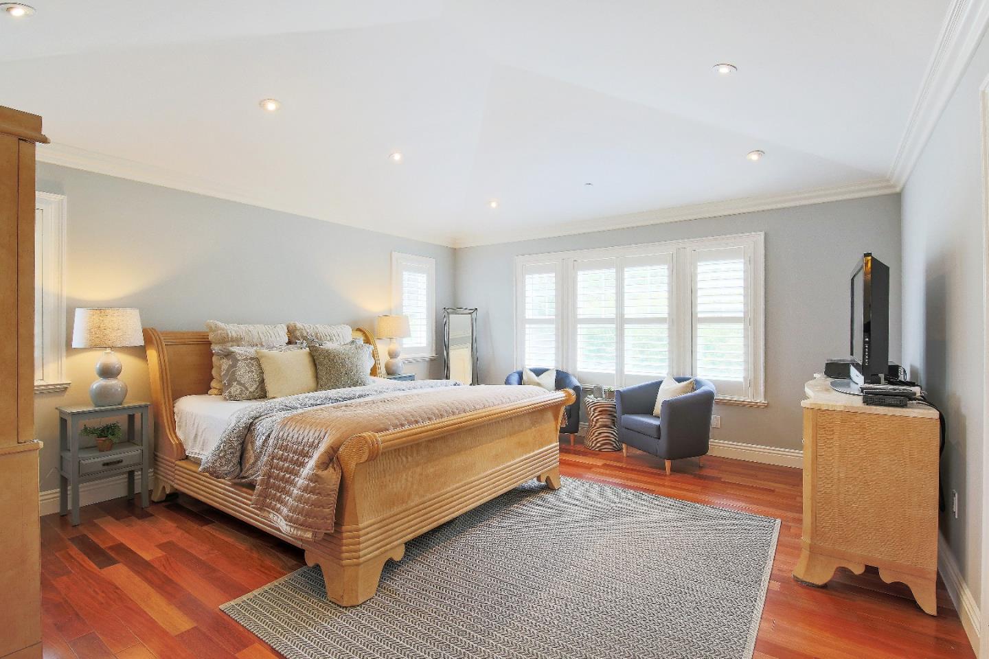 1637 Westmoor Road Burlingame, CA 94010 - Photo 35 of 54 a spacious bedroom with a large bed and a couch