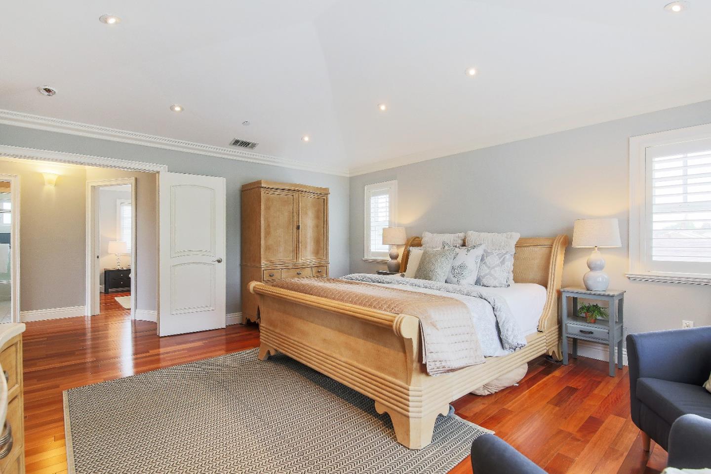 1637 Westmoor Road Burlingame, CA 94010 - Photo 36 of 54 a spacious bedroom with a bed and a couch