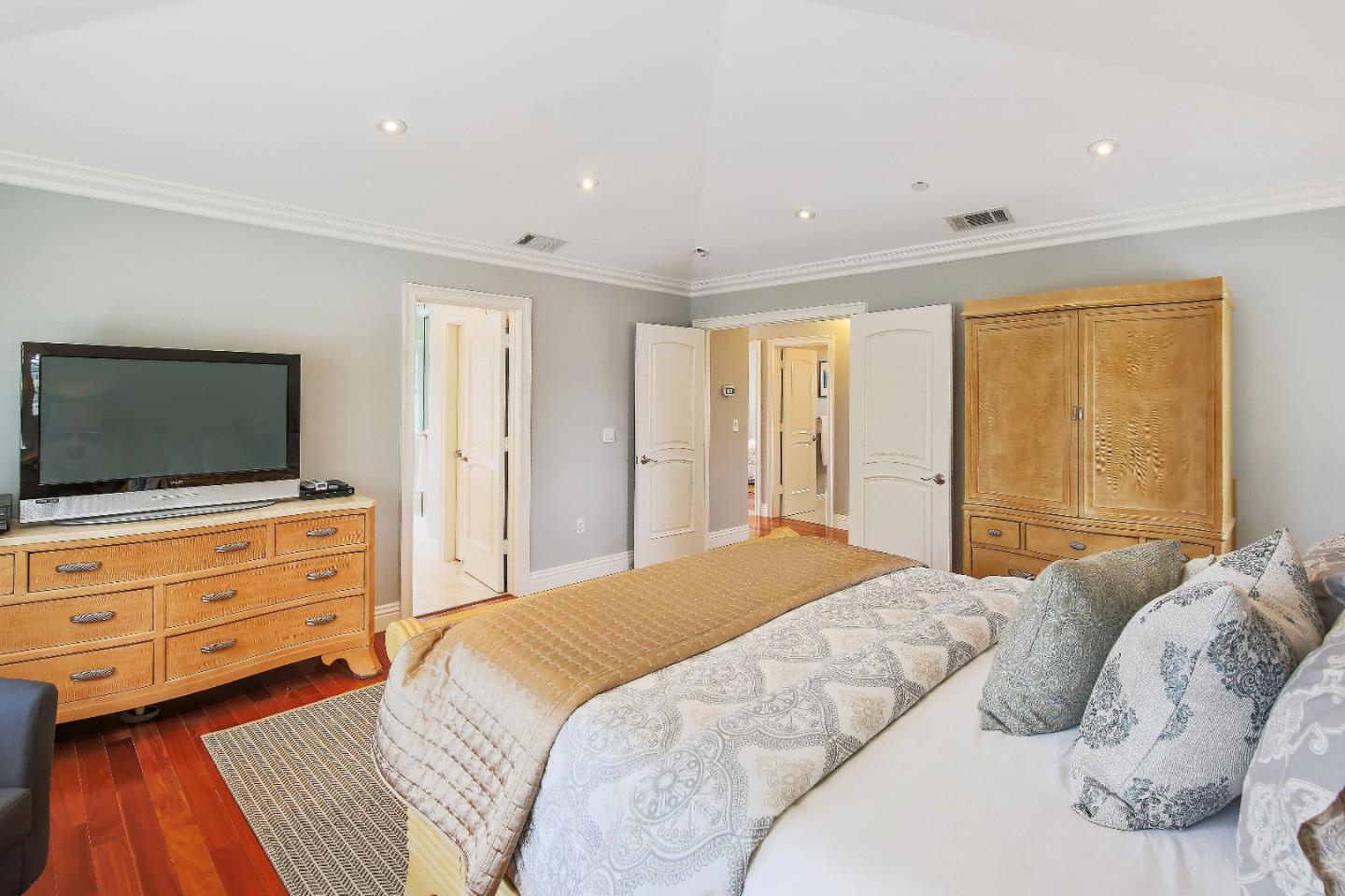 1637 Westmoor Road Burlingame, CA 94010 - Photo 37 of 54 a bedroom with a bed and flat screen tv