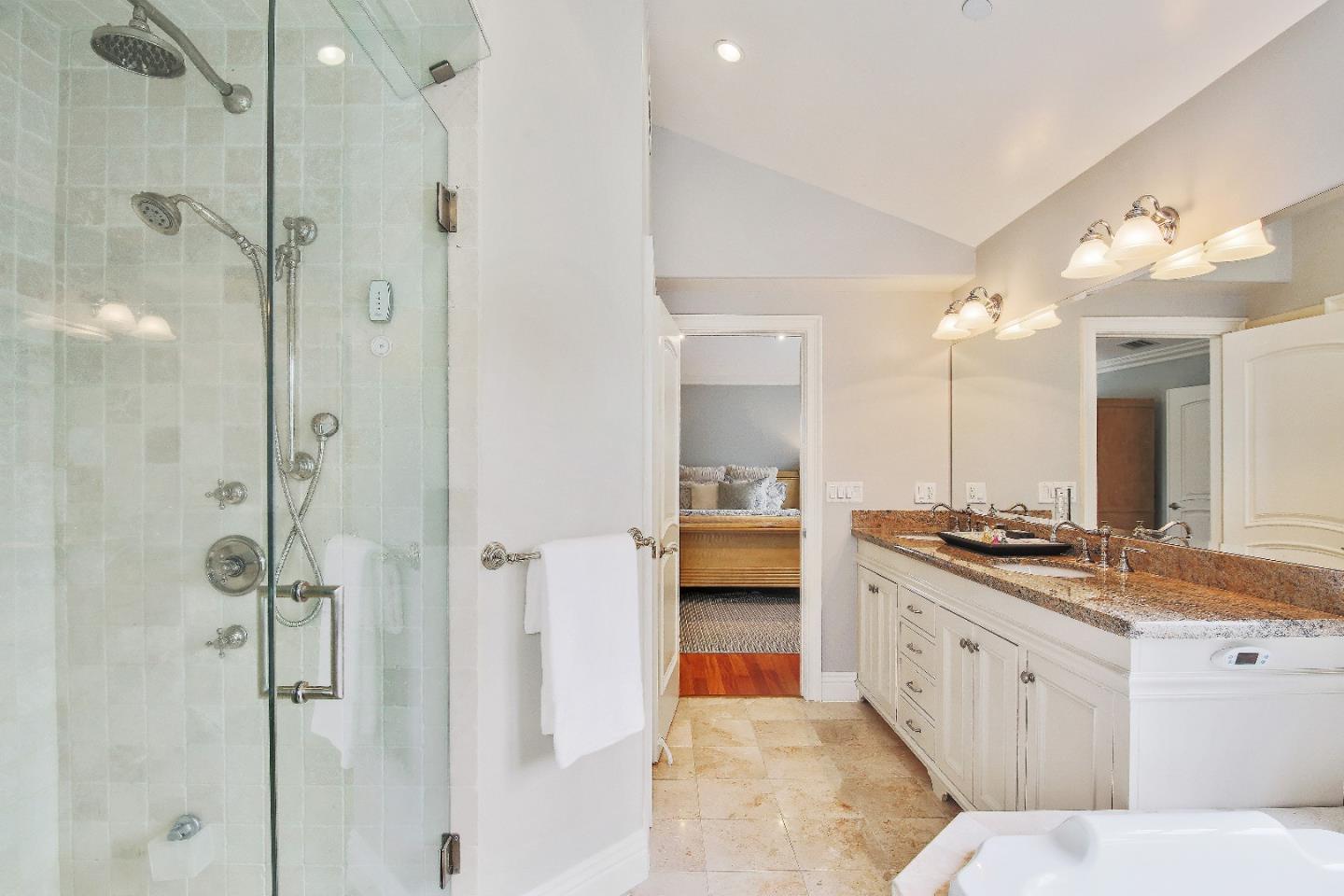 1637 Westmoor Road Burlingame, CA 94010 - Photo 40 of 54 a spacious bathroom with a granite countertop sink mirror and shower
