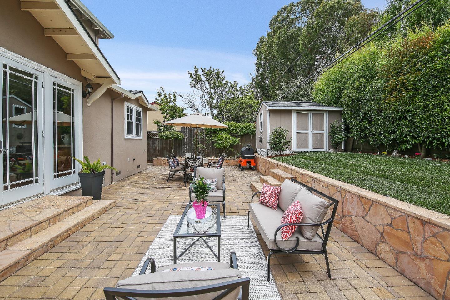 1637 Westmoor Road Burlingame, CA 94010 - Photo 53 of 54 a backyard of a house with table and chairs