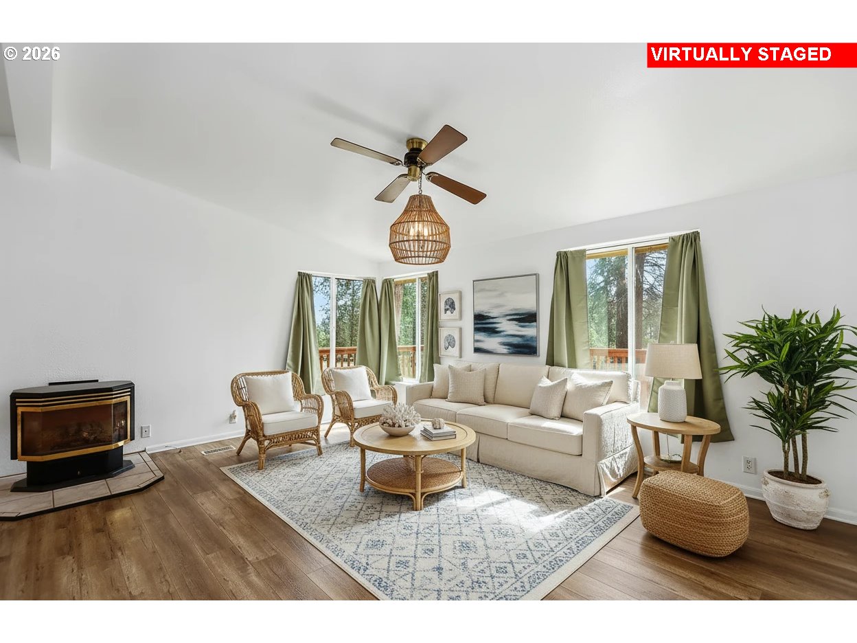 39 North Eagle Point Road Tygh Valley, OR 97063 - Photo 12 of 34 a living room with furniture a window and a chandelier