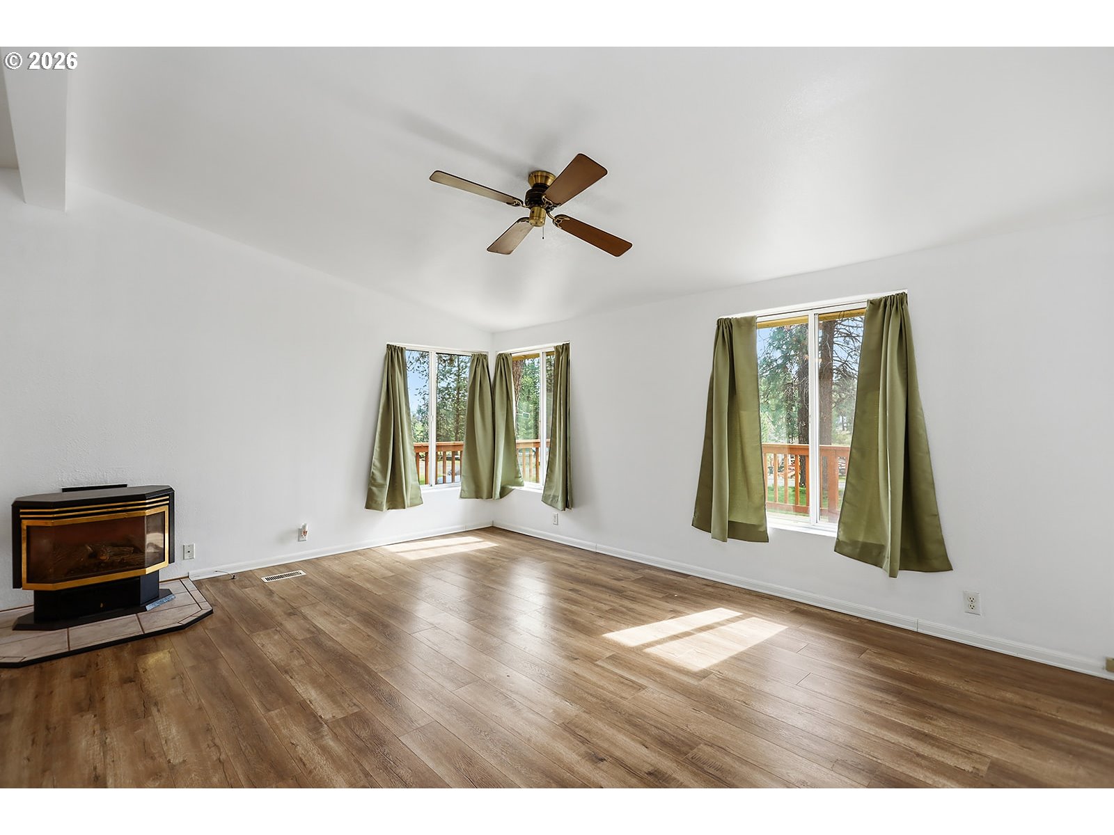 39 North Eagle Point Road Tygh Valley, OR 97063 - Photo 13 of 34 a view of an empty room with a window and wooden floor