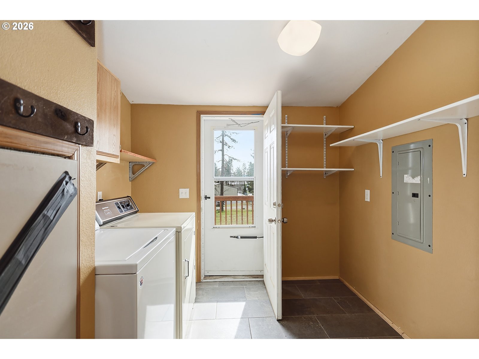 39 North Eagle Point Road Tygh Valley, OR 97063 - Photo 16 of 34 a kitchen with a refrigerator and a stove
