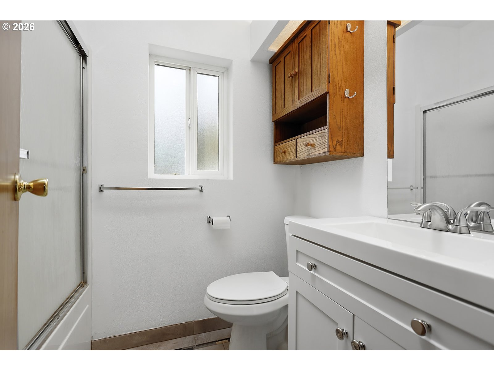 39 North Eagle Point Road Tygh Valley, OR 97063 - Photo 18 of 34 a bathroom with a toilet a sink a mirror and a window