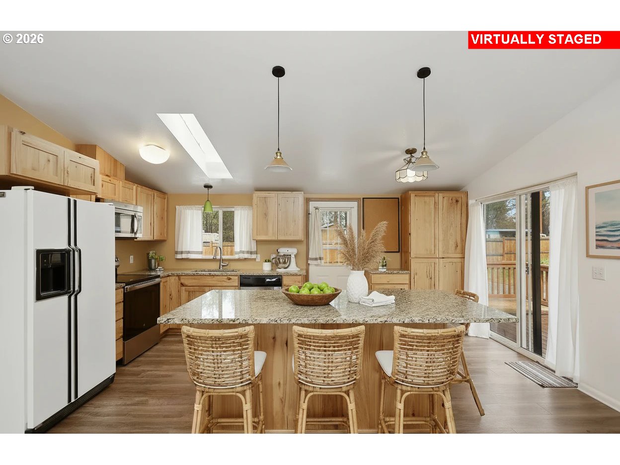 39 North Eagle Point Road Tygh Valley, OR 97063 - Photo 6 of 34 a kitchen with sink refrigerator and cabinets