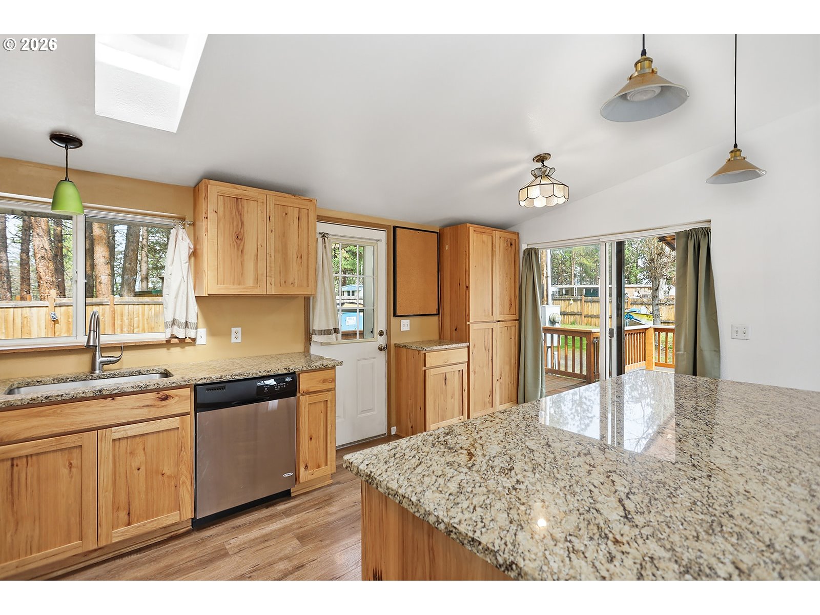 39 North Eagle Point Road Tygh Valley, OR 97063 - Photo 10 of 34 a kitchen with stainless steel appliances granite countertop a sink cabinets and window