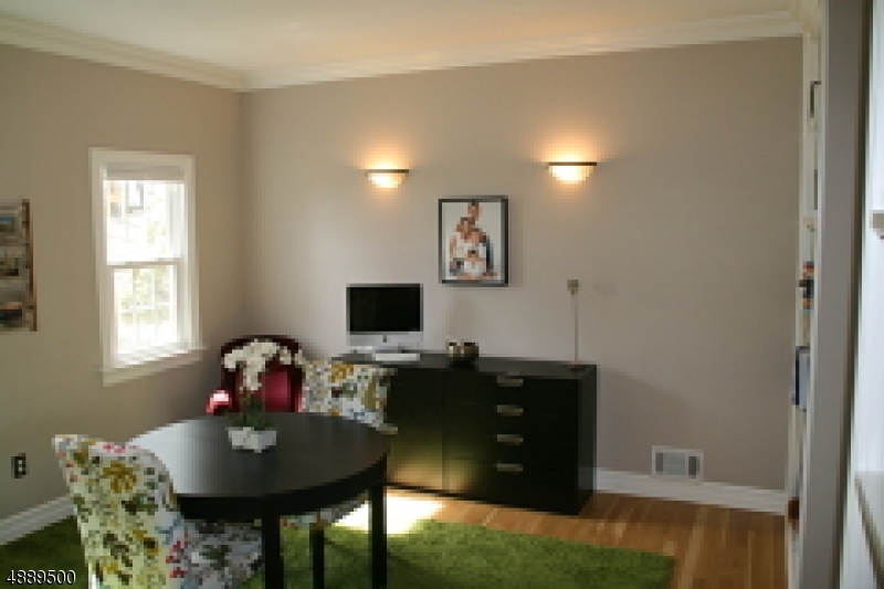 22 Rolling Hill Drive Morristown, NJ 07960 - Photo 11 of 17 a living room with furniture and a flat screen tv