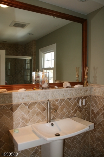 22 Rolling Hill Drive Morristown, NJ 07960 - Photo 13 of 17 a bathroom with a tub sink and mirror