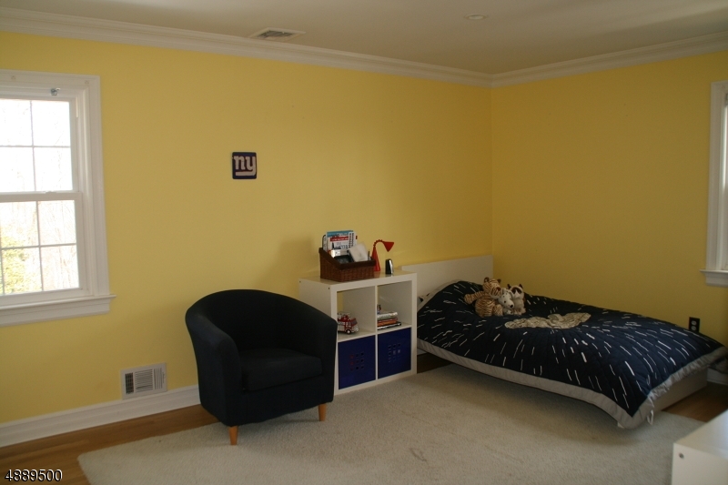 22 Rolling Hill Drive Morristown, NJ 07960 - Photo 15 of 17 a bedroom with a bed and a window