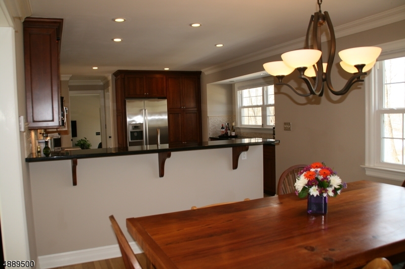 22 Rolling Hill Drive Morristown, NJ 07960 - Photo 4 of 17 a view of a kitchen and dining room