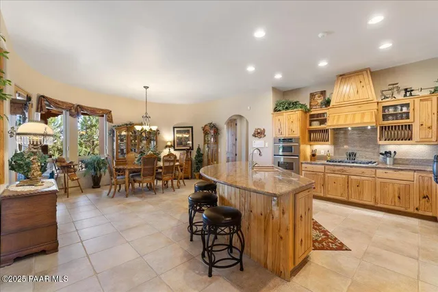 a view of a kitchen with fridge and workspace