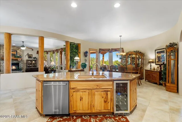 a view of balcony with chairs and wooden fence