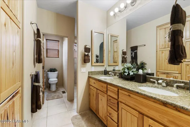 a view of a house with potted plants