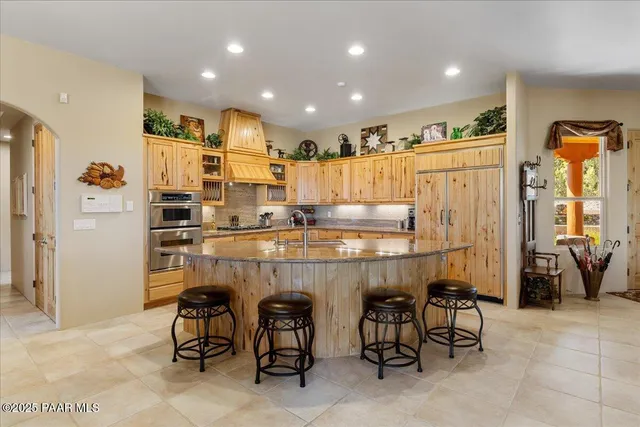 a view of a patio with a dining table and chairs