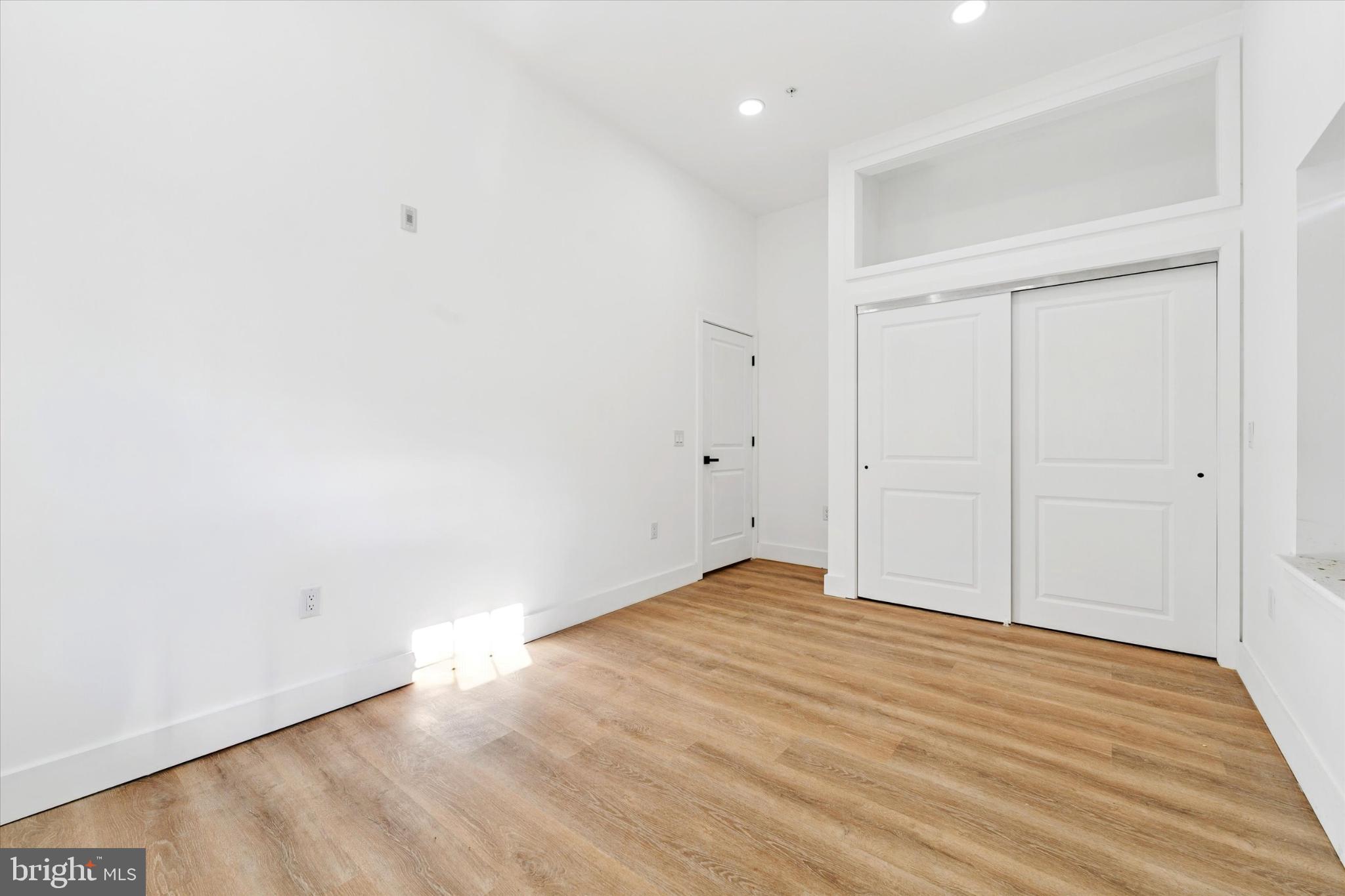 2424 West Thompson Street, Unit 3 Philadelphia, PA 19121 - Photo 14 of 14 an empty room with wooden floor
