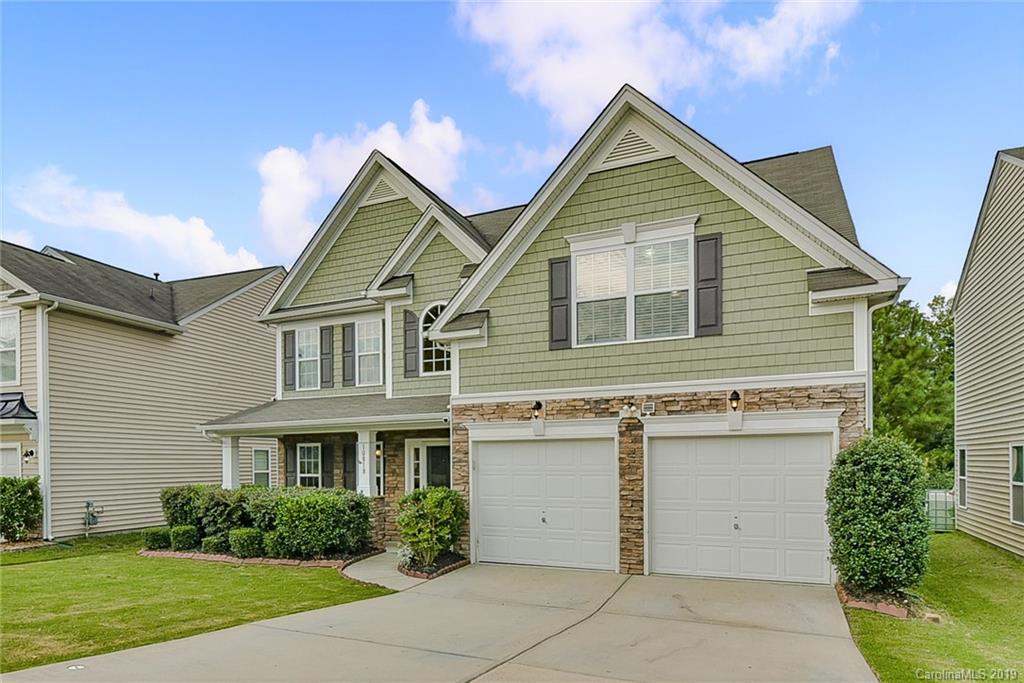 10818 Greenhead View Road Charlotte, NC 28262 - Photo 2 of 39 a view of a house in front of a yard with potted plants