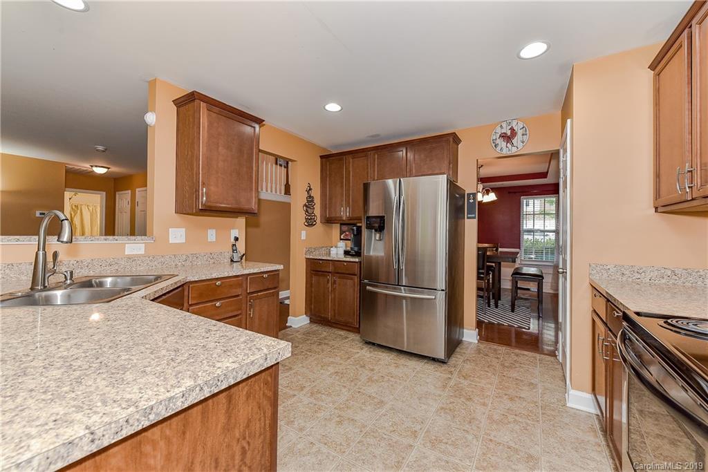 10818 Greenhead View Road Charlotte, NC 28262 - Photo 12 of 39 a kitchen with stainless steel appliances granite countertop a refrigerator and a sink