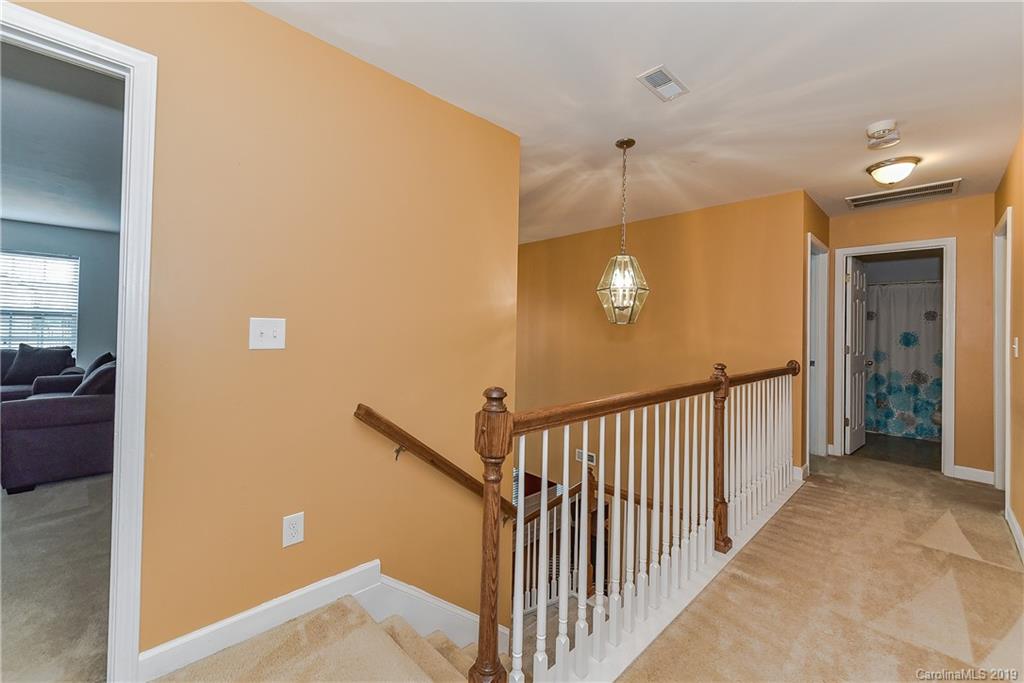 10818 Greenhead View Road Charlotte, NC 28262 - Photo 18 of 39 a view of a hallway with entryway to a bedroom