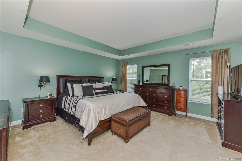 10818 Greenhead View Road Charlotte, NC 28262 - Photo 19 of 39 a bedroom with a bed and furniture