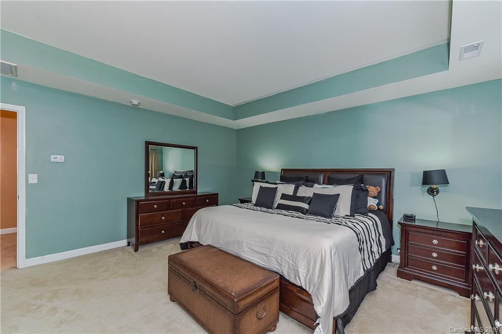 10818 Greenhead View Road Charlotte, NC 28262 - Photo 20 of 39 a bedroom with a bed and a dresser