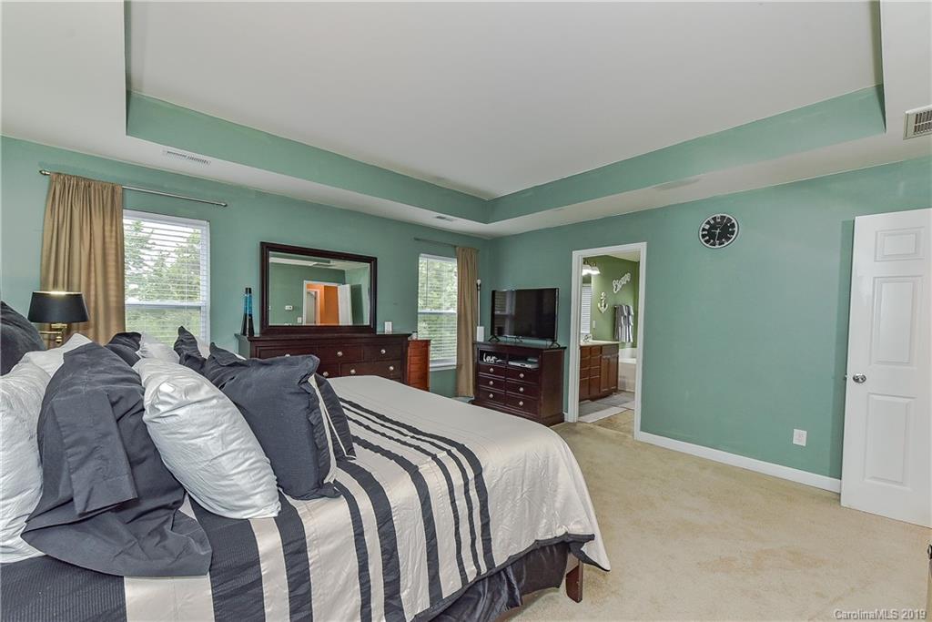 10818 Greenhead View Road Charlotte, NC 28262 - Photo 21 of 39 a bed room with a bed and a television