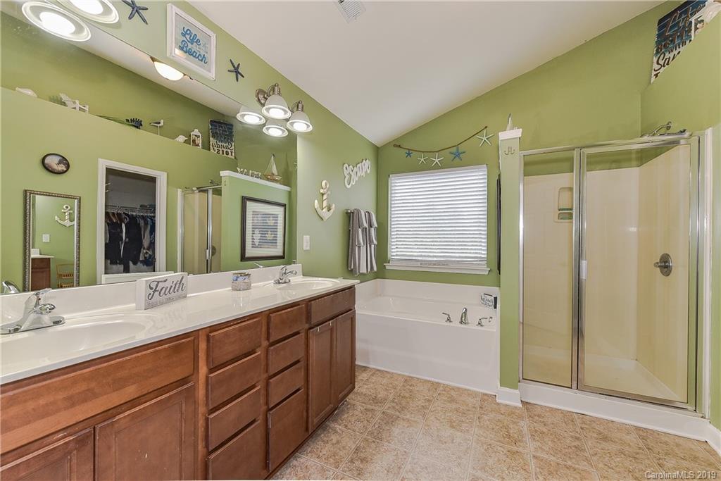 10818 Greenhead View Road Charlotte, NC 28262 - Photo 22 of 39 a spacious bathroom with a double vanity sink mirror and shower