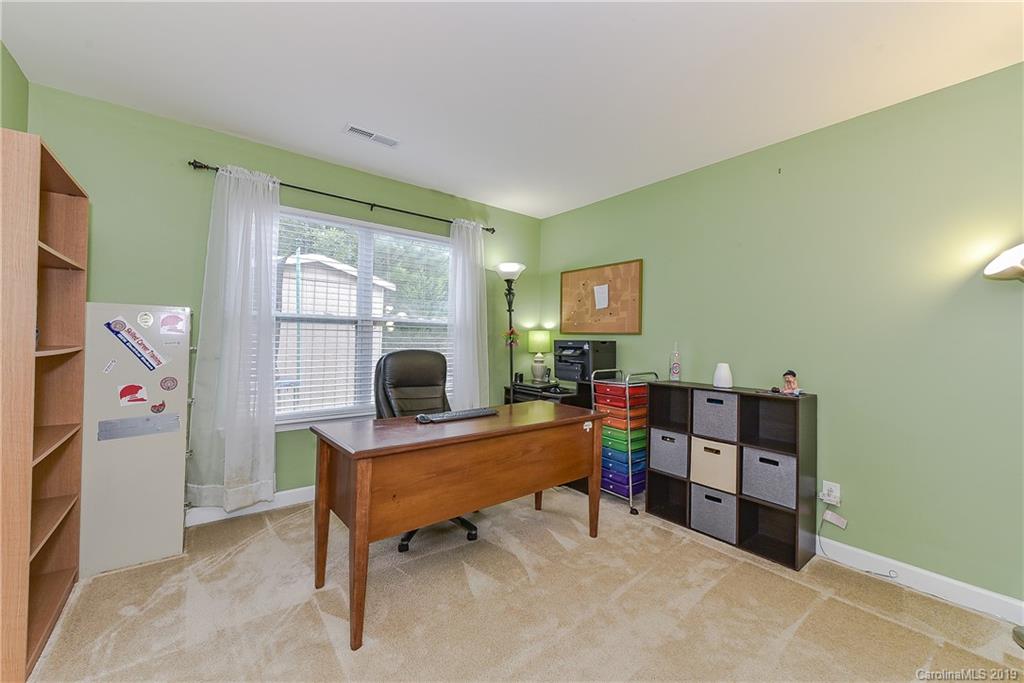 10818 Greenhead View Road Charlotte, NC 28262 - Photo 24 of 39 a bedroom with furniture and a wooden floor
