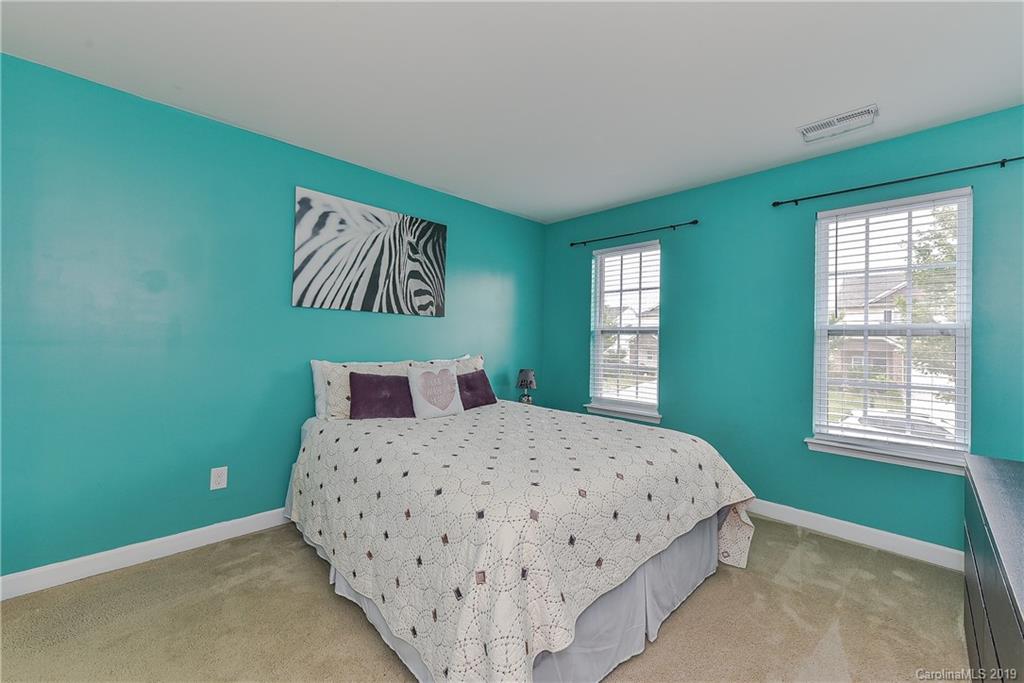10818 Greenhead View Road Charlotte, NC 28262 - Photo 28 of 39 a bedroom with a bed and window