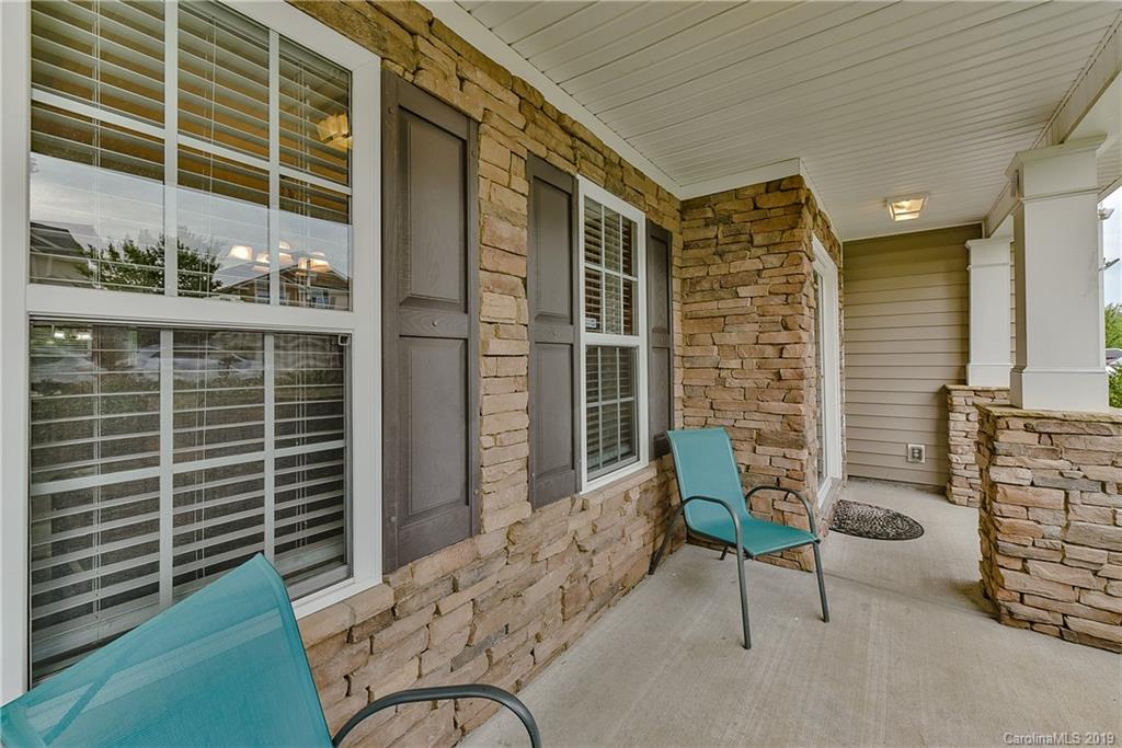 10818 Greenhead View Road Charlotte, NC 28262 - Photo 5 of 39 a balcony with furniture and a window