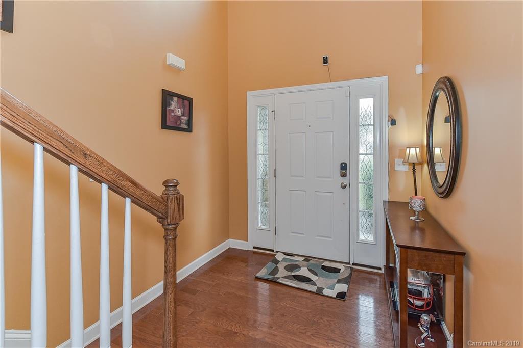10818 Greenhead View Road Charlotte, NC 28262 - Photo 6 of 39 a view of a livingroom with wooden floor and white walls