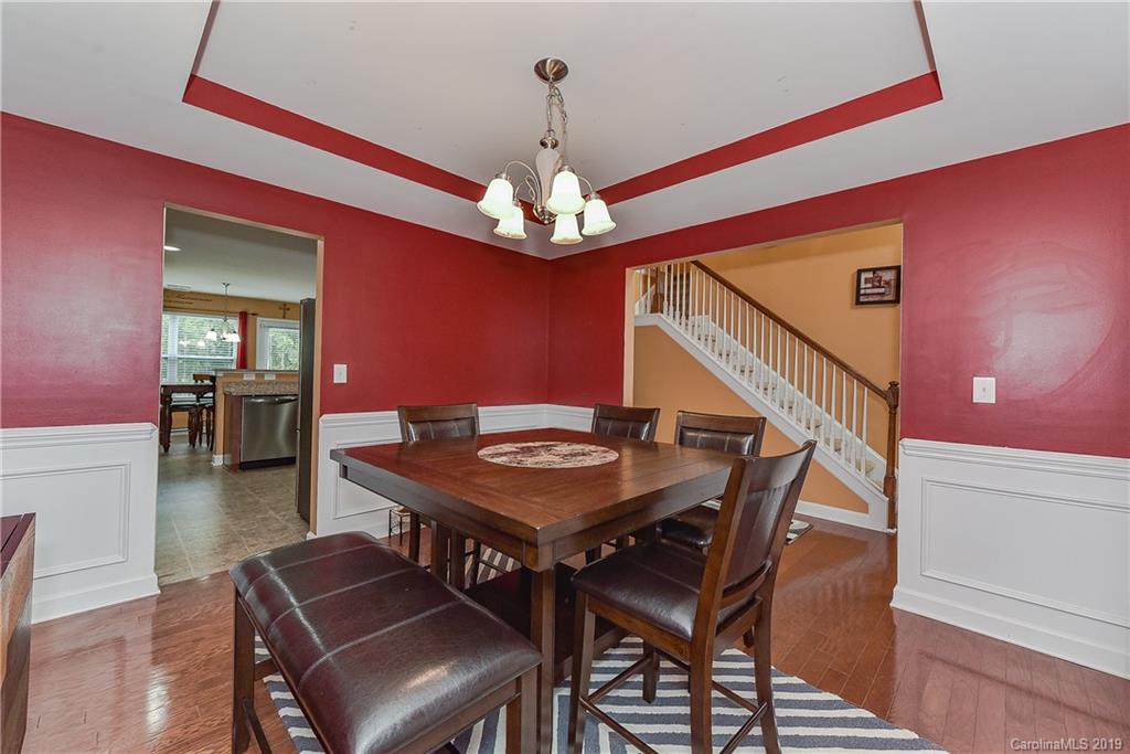 10818 Greenhead View Road Charlotte, NC 28262 - Photo 7 of 39 a view of a dining room with furniture and wooden floor