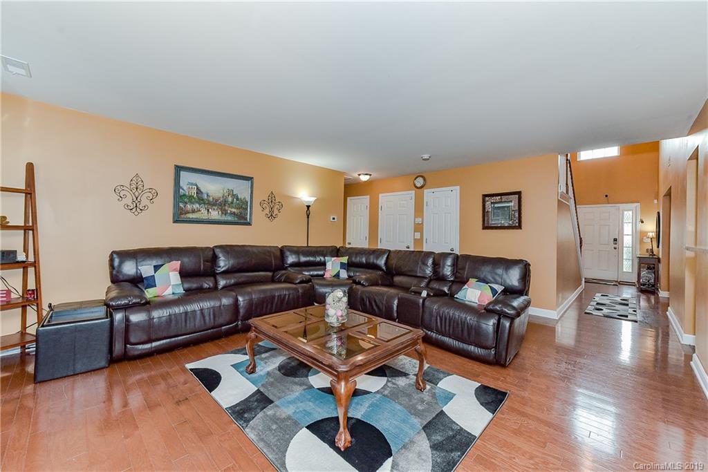 10818 Greenhead View Road Charlotte, NC 28262 - Photo 10 of 39 a living room with furniture and a rug